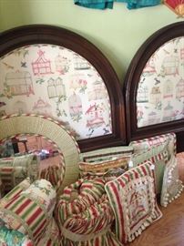 Doubled king head board with coordinating bedding, pillows, and mirror