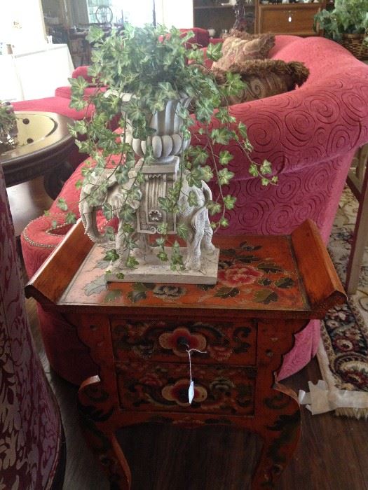 Large sofa; small painted 2-drawer table; elephant planter