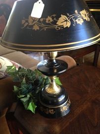 One of two black and gold vintage lamps