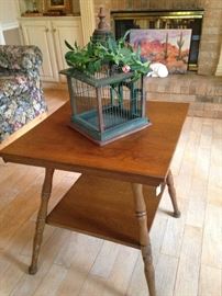 Two-tiered square table; small bird cage