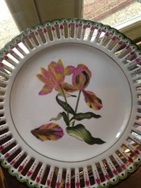 One of two floral riticulated coordinating plates