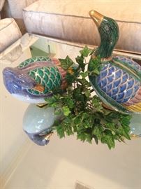 Colorful ducks on mirrored coffee table