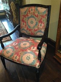 Upholstered arm chair in coral and turquoise