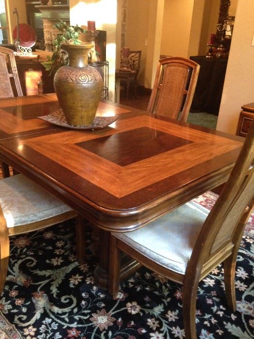 Dining table and chairs have matching server and china cabinet.