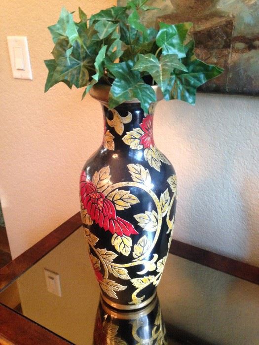 Red, gold, and black vase
