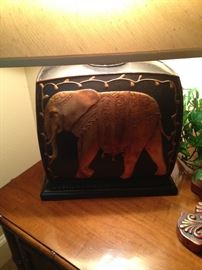 The elephant lamp enhances the theme of the room.