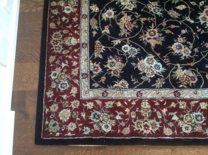 Rug in the entry measures 5 x 8...black with burgundy$100 