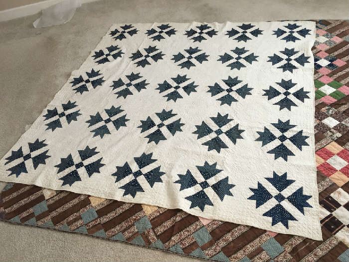 ANTIQUE BLUE AND WHITE QUILT ( LAYING ON TOP OF PREVIOUSLY DESCRIBED CRAZY QUILT).EXCELLENT WORKMANSHIP AND DETAIL.
