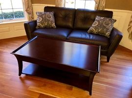 Leather sofa with cocktail table. Table is great! It is on wheels and rolls easily.