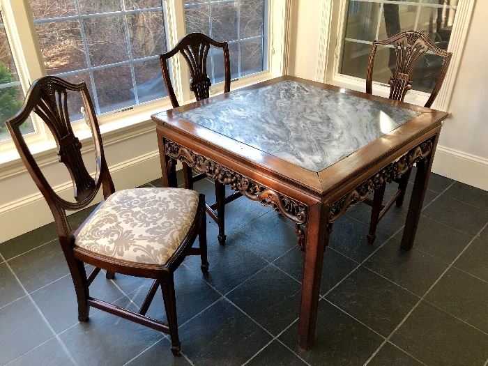 Marble-top, antique rosewood Chinese table with intricate carved apron