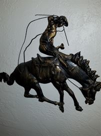 Lots of metal cowboy art