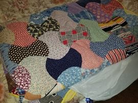 Lots of homecrafted Quilts