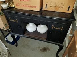 Buffett/Credenza...I believe it has fold out top. Black and Gold accents. 