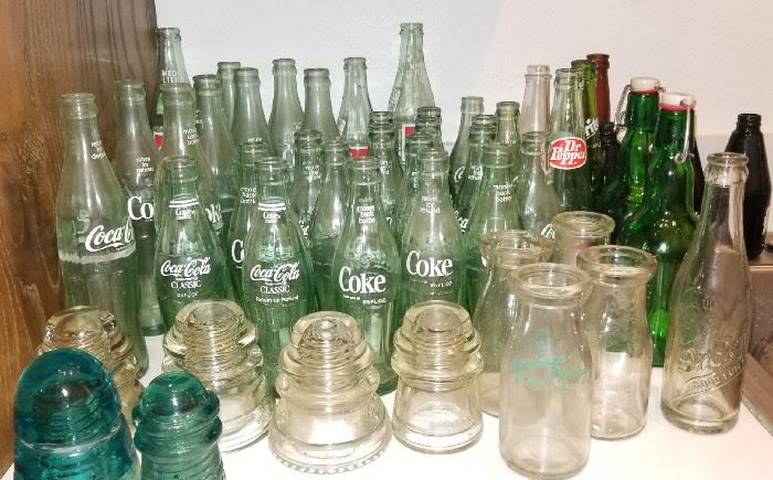 Several vintage Coca Cola bottles, other misc soda & milk bottles, insulators, etc...