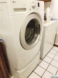 Front Loading LG Washing Machine on Pedistal.    Whirlpool Dryer