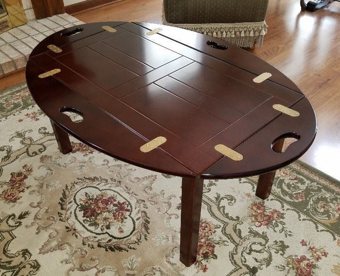 Solid wood butler's table with brass hinges, dark cherry finish, by Bombay Company.  45" x 30", 18.5" tall.