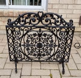 Vintage cast iron fireplace screen on legs.  26" wide by 26" tall.