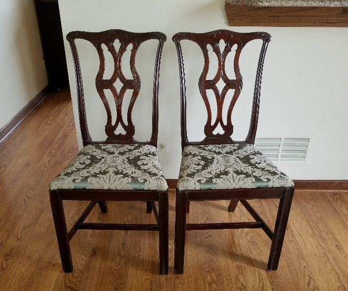 Very vintage smaller size mahogany chairs, relief carved backs, sage green brocade seats.