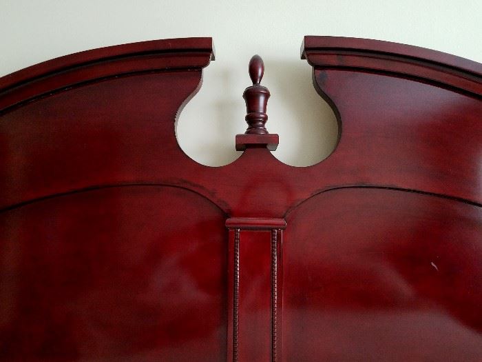 King size bed:  Dark Cherry headboard, curved top with pediment and beaded detail.  Includes frame, mattress and box spring.