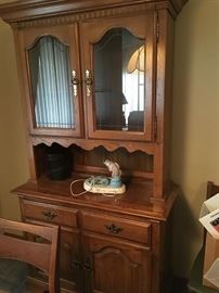 This is a nice china cabinet done in oak.