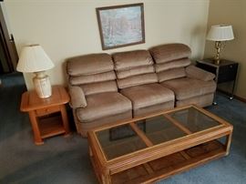 This couch is part of a sectional -- a nice coffee table as well.