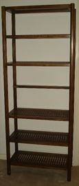 One of a pair of vintage shelves with wood and caning