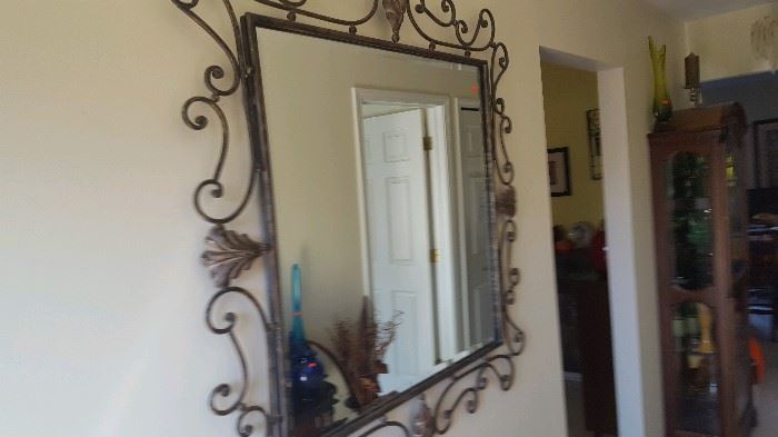 Large heavy weight decorative mirror.  Side to side and top to bottom size is 45 x 45.