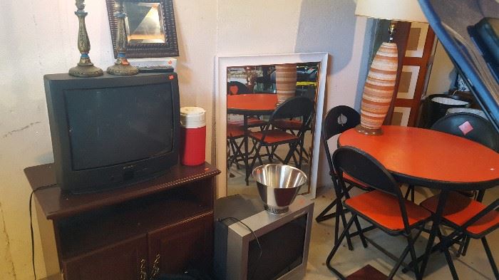Vintage ceramic lamp and card table and 4 chairs. Mirror and TV stand and TV's.
