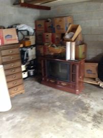 console  TV and remote, odd chest of drawers, shelves of house hold items crock pots, small heaters, coffee pots , etc..