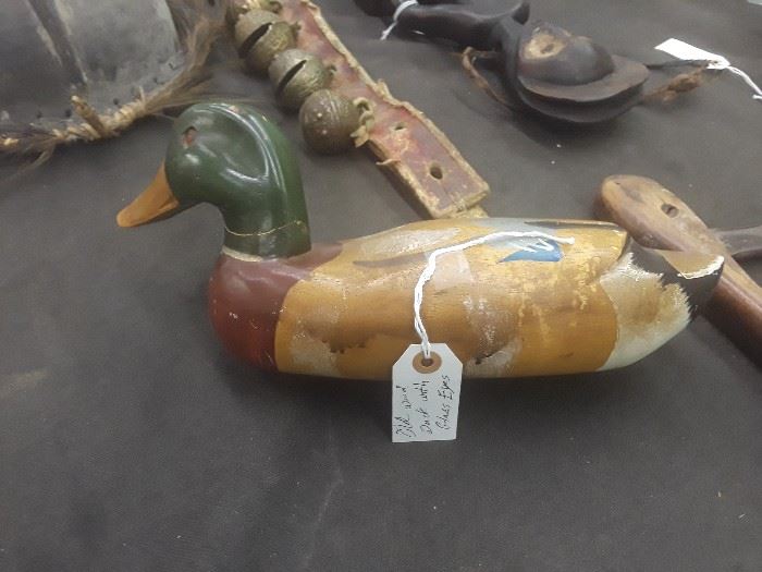 Old wooden duck with a glass eyes