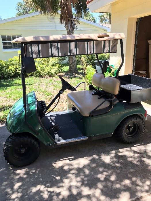 EZ - Go gas powered cart with carry box, fresh tires, lights & turn signals