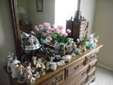 DRESSER WITH A FEW OF THE FIGURINES AND COLLECTIBLES