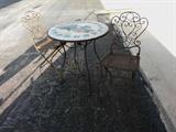 Wrought iron bistro table and two chairs