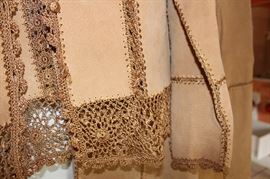 close up of trim on suede skirt and jacket