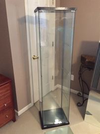 Glass trophy or collectible case: Measures about: 64" high, 14" deep, 16" wide.  Comes with glass shelves