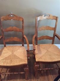 Two arm chairs with rush seats