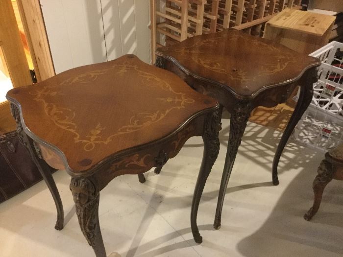 Pair of French side tables with carved faces