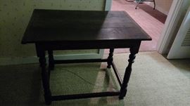 antique side table with wooden pegs