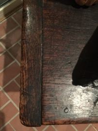 wooden pegs on antique side table