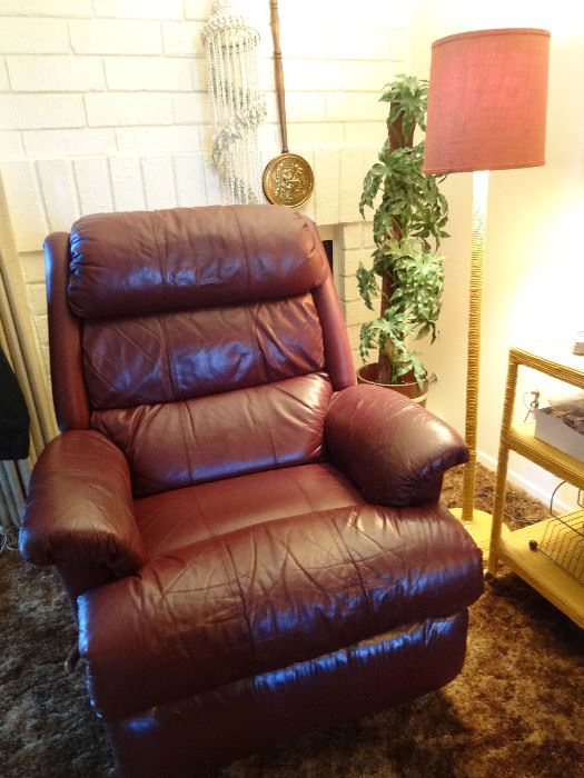 This chair is perfect, the discoloration is just a reflection.  A deep burgundy color, no damage....soooo comfy!