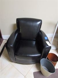 Black leather chair, trash cans