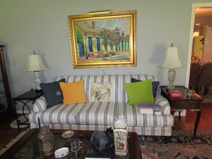 Broyhill custom stripe sofa, pillow decor, Porcelain and crystal table lamps, Mahogany tea table, Iron and Mahogany side table.  Frederick Guess / New Orleans original painiting.  