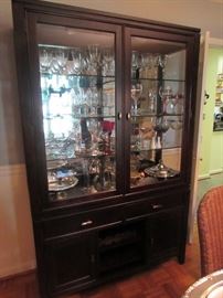 Dark stain contemporary dining room china cabinet.