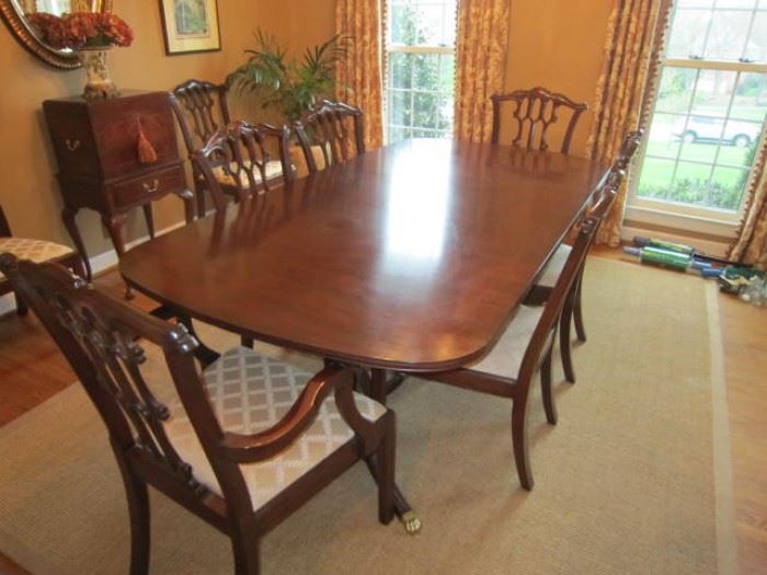 Henkel Harris double pedestal dining table with 2 arm chairs and 6 side chairs. 68"-108" x 44"