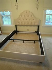 Queen bed with tufted headboard, upholstered rails and footboard