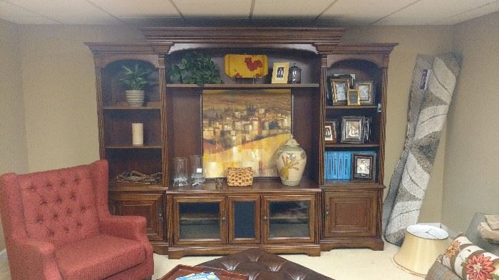 Large 3 piece media cabinet.  It breaks down into 6 pieces for easy moving.  the end bookcases and lower center cabinet can be used separately.