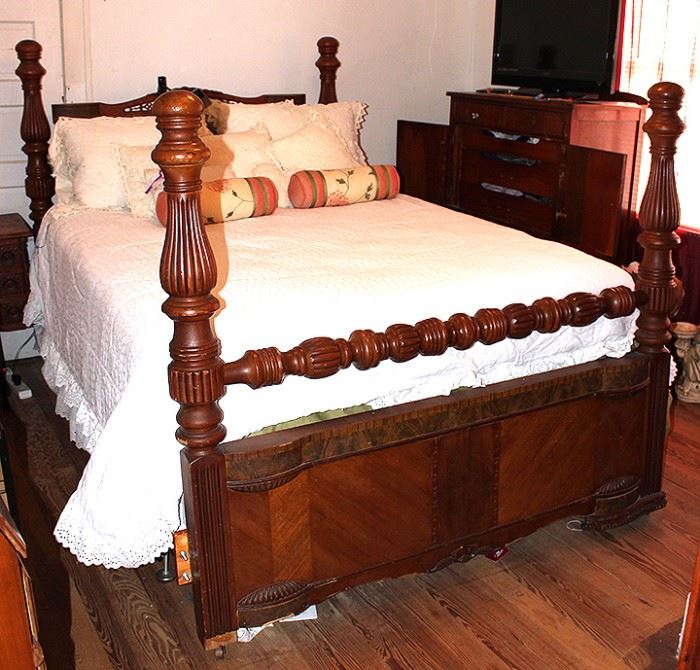 Antique bed on casters