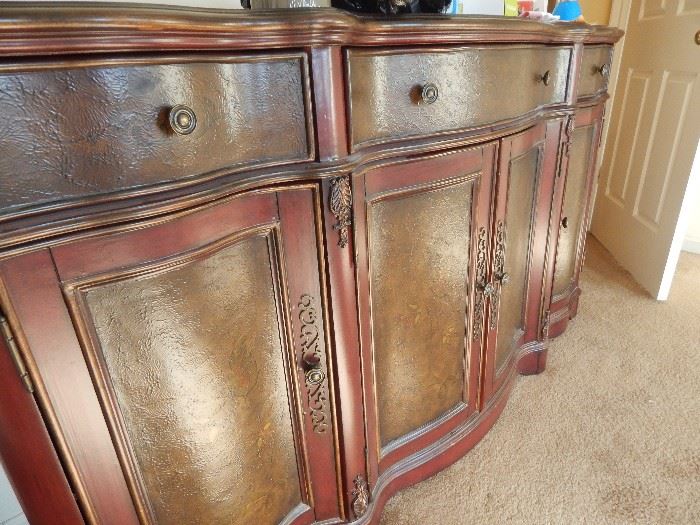 Bow front cabinet.