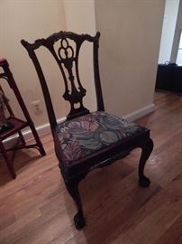 One of five chairs in this dining room setting. Ball and claw feet on these Chippendale chairs.
