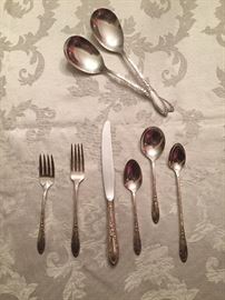 Heirloom sterling silver.  "Virginian." 8 place settings including soup & iced tea spoons.  Some serving pieces.